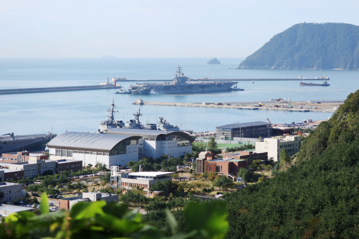 U.S. Navy aircraft carrier USS Ronald Reagan approaches a port in Busan