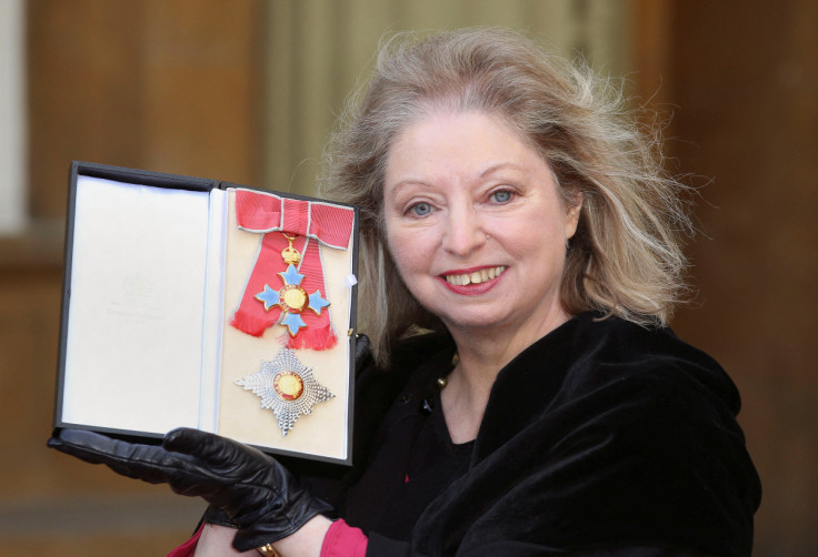 Author Hilary Mantel poses with her Commander of the British Empire award at Buckingham Palace in London