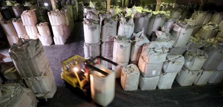 A worker transports 1-tonne super sacks with coffee beans for export at a coffee warehouse in Santos