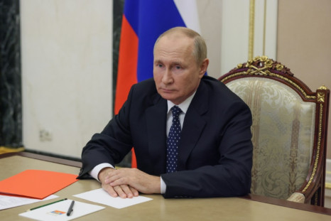 Russian President Vladimir Putin chairs a Security Council meeting via a video link in Moscow on September 23, 2022