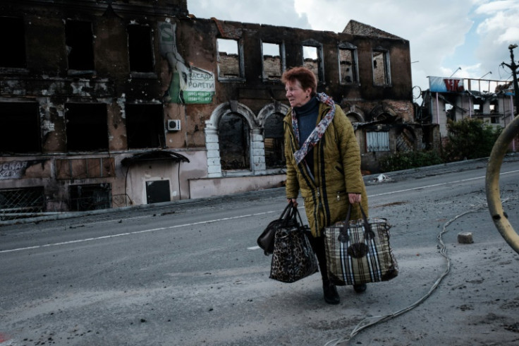 A trickle of refugees have been walking through the shellfire towards Ukrainian territory