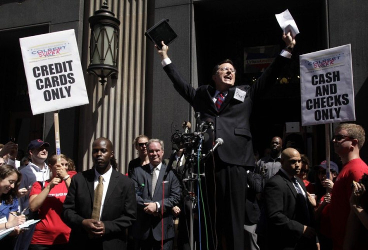 Stephen Colbert greets a crowd outside the Federal Election Commission