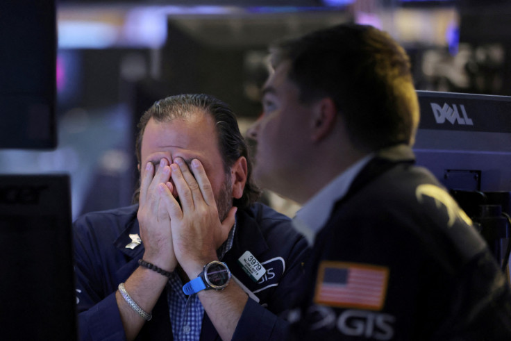 Traders work on the trading floor at the New York Stock Exchange (NYSE) in Manhattan, New York City