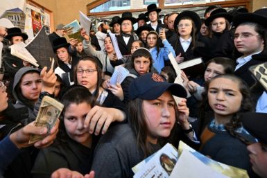 Children of Hasidic Jewish pilgrims leave after praying at Rabbi Nachman's tomb as they mark Rosh Hashana, the Jewish new year, in Uman, some 200km from Kyiv