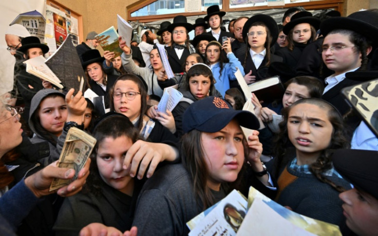 Children of Hasidic Jewish pilgrims leave after praying at Rabbi Nachman's tomb as they mark Rosh Hashana, the Jewish new year, in Uman, some 200km from Kyiv