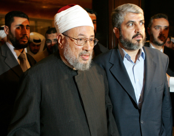 Hamas' exiled politburo Khaled Meshaal and Egyptian-born Sheikh Yussef al-Qaradawi arrive in Doha