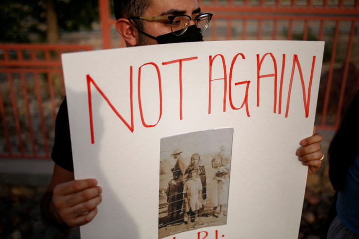 Activists defending the rights of migrants hold a protest near Fort Bliss to call for the end of the detention of unaccompanied minors at the facility in El Paso
