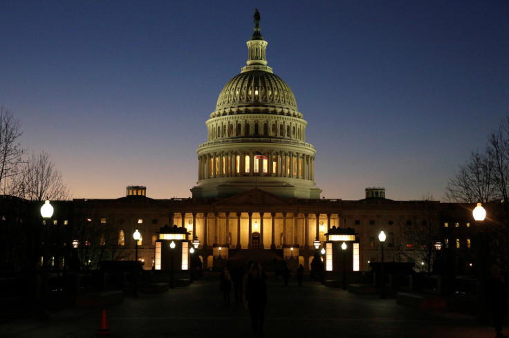 The U.S. Capitol Building is lit at sunset in Washington