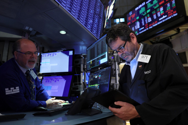 Traders work on the floor of the NYSE in New York