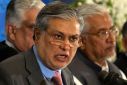 Pakistan's Finance Minister Dar announces the result of the first auction for 3G mobile phone networks during a news conference in Islamabad