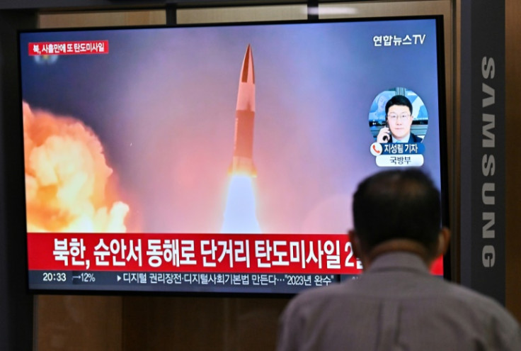 A man watches a news broadcast at a rail station in Seoul on Wednesday showing file footage of a North Korean missile test