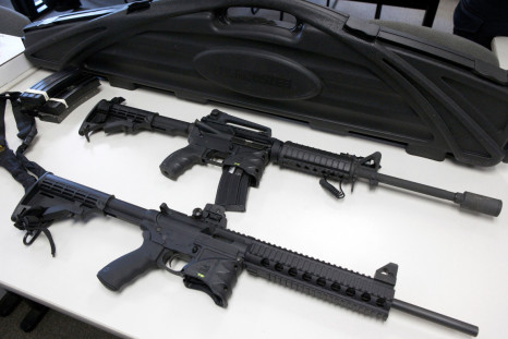 A Bushmaster semi-automatic assault rifle and a Smith & Wesson semi-automatic rifle are turned in during a gun buyback event in New Haven