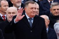 Bosnia's member of tripartite presidency Milorad Dodik waves to people during parade celebrations to mark their autonomous Serb Republic's national holiday, in Banja Luka