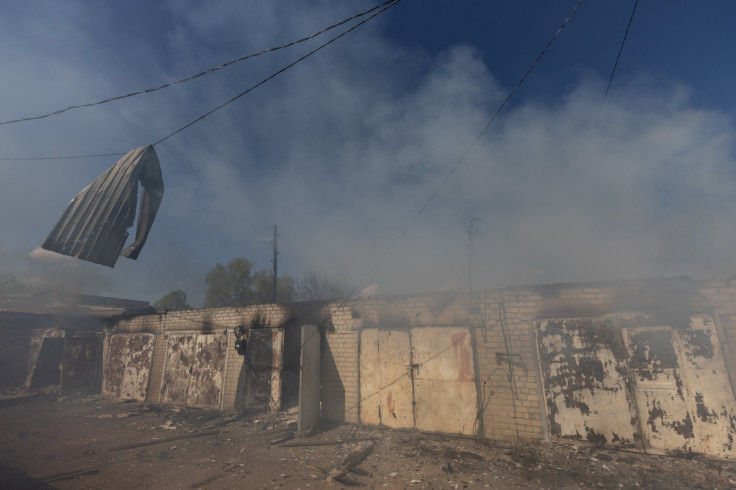 A garage burns following a military strike on a garage near the railway station, amid Russia's invasion of Ukraine, in the frontline city of Lyman, Donetsk region