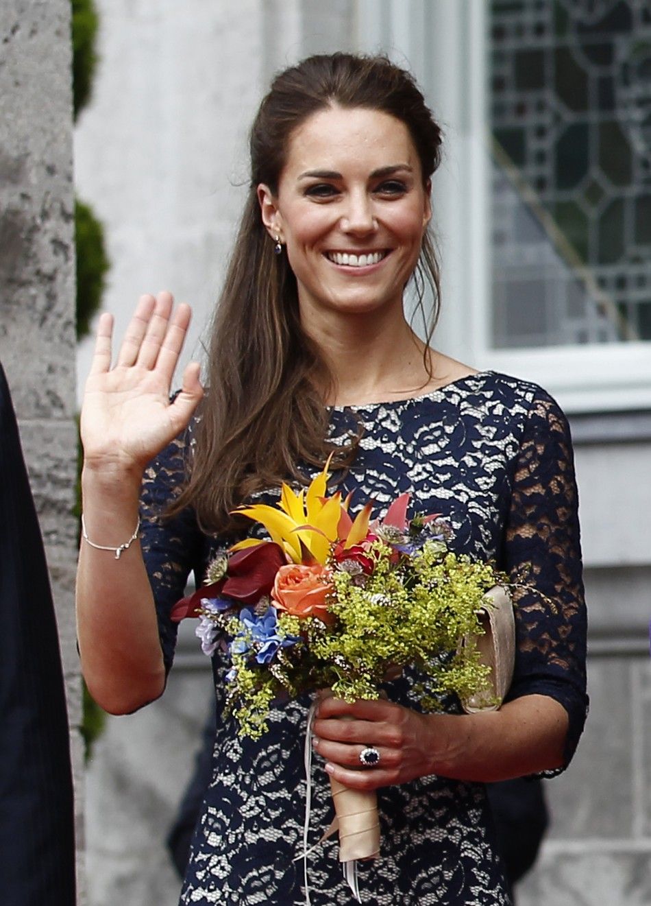  Catherine, Duchess of Cambridge, waves during an official welcoming ceremony at Rideau Hall in Ottawa