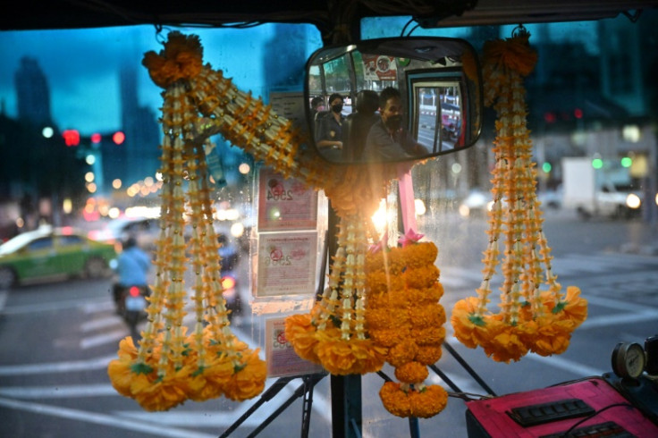 No.8 driver Aphisak supplements his daily wage of between 150-200 baht (roughly $5) with 10 percent of the daily ticket sales