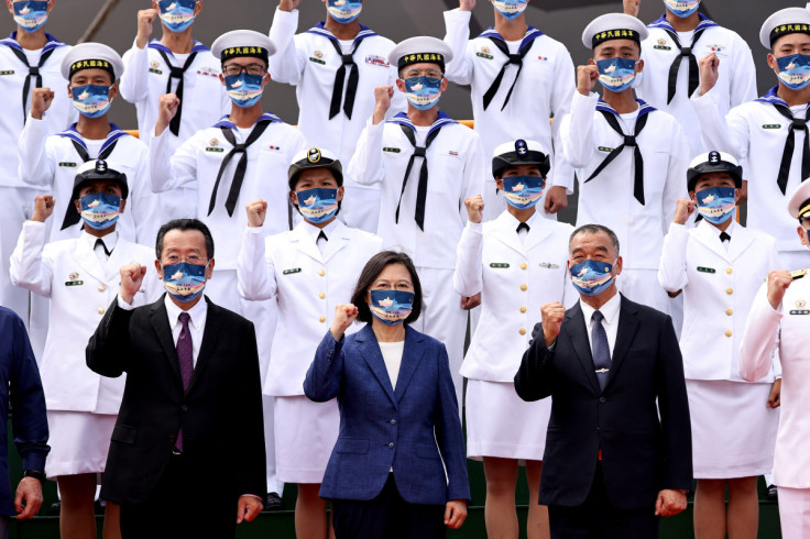 Taiwan President Tsai Ing-wen takes a group photo at a delivery ceremony for the Navy's Yushan amphibious landing dock in Kaohsiung
