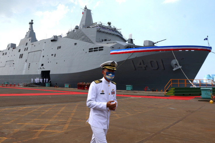 A Navy officer takes part in a delivery ceremony for the Navy's Yushan amphibious landing dock in Kaohsiung