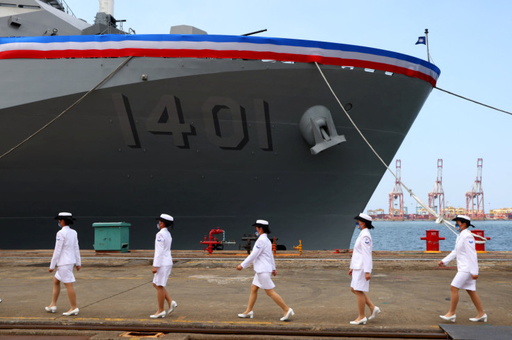 Members of the Navy take part in a delivery ceremony for the Navy's Yushan amphibious landing dock in Kaohsiung