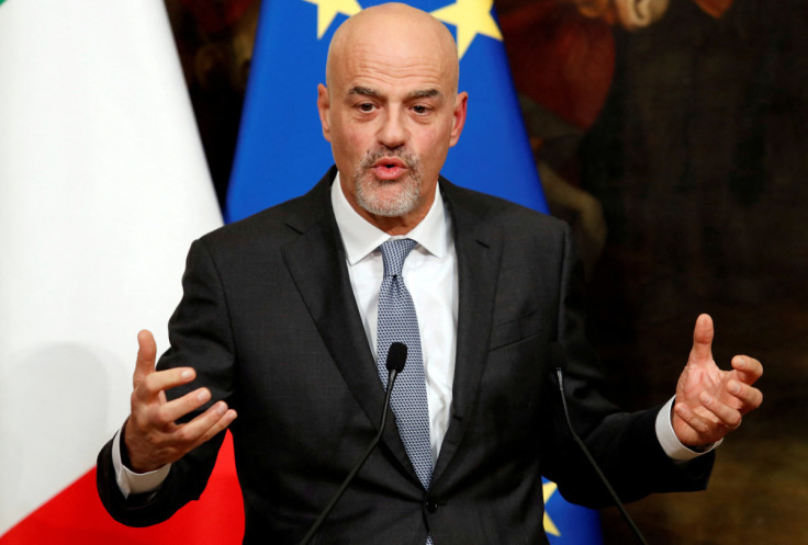 Italian oil major Eni's CEO Descalzi gestures during a news conference to present an agreement on research in alternative fuels and carbon-cutting technologies in Rome