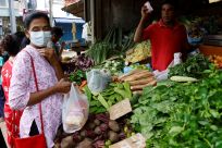 A vendor sells vegetables to a customer amid the rampant food inflation, amid Sri Lanka's economic crisis, in Colombo
