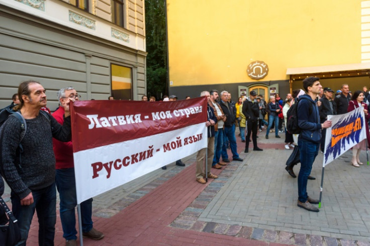 A protest banner reads "Latvia my country. Russian - my language" as the war in Ukraine brings to the surface the issue of attachment to country versus cultural and linguistic identity