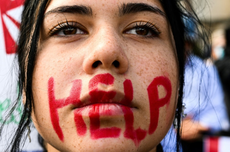 A young woman takes part in a protest on October 1, 2022 in Rome, following the death last month of Kurdish woman Mahsa Amini in Iranian morality police custody