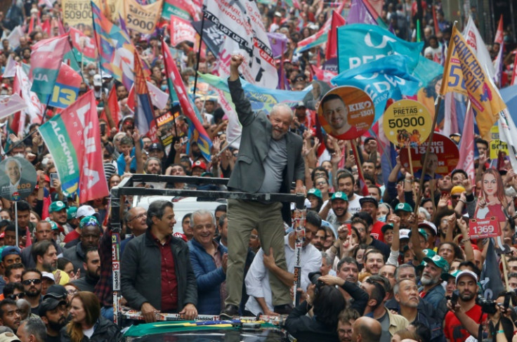 Brazil presidential candidate Luiz Inacio Lula da Silva greets supporters during a campaign rally on the eve of the presidential election in Sao Paulo,on October 1, 2022