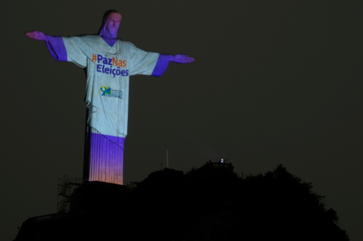 The Christ the Redeemer statue is illuminated with the message "Peace in the Elections" in Rio de Janeiro on October 1, 2022