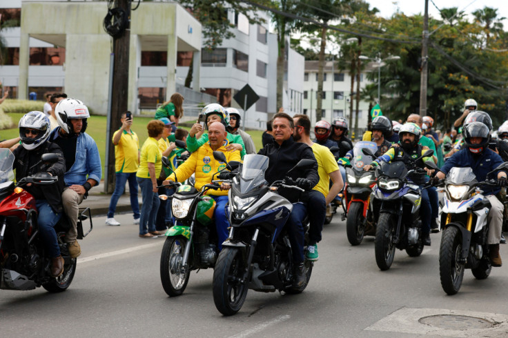 Brazil's President and candidate for re-election Jair Bolsonaro leads a motorcade, in Joinville
