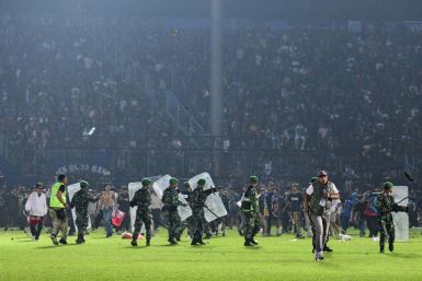 Several thousand fans descended to the pitch, some angry, some who wanted to shake the players' hands of home team Arema FC after the loss to their fierce rivals