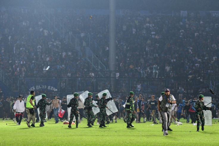 Several thousand fans descended to the pitch, some angry, some who wanted to shake the players' hands of home team Arema FC after the loss to their fierce rivals