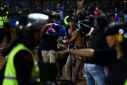 At least 174 Indonesians died in stampede when police tear-gassed fans invading football pitch