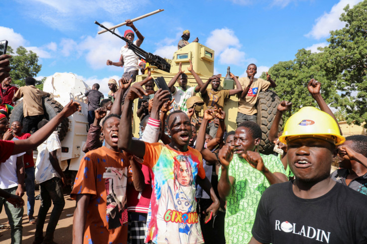 Supporters of Burkina Faso's self-declared new leader Ibrahim Traore demonstrate holding a Russian flag, in Ouagadougou