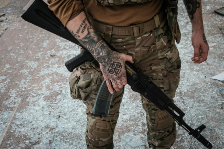 A Ukrainian soldier at the retaken station on Sunday