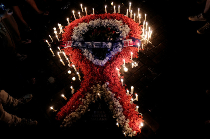 Ribbon-shaped candles and petals are pictured during a vigil, after a riot and stampede following a soccer match between Arema vs Persebaya in Denpasar,