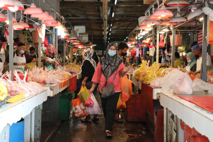 Shoppers wearing protective masks shop at a market, amid the coronavirus disease (COVID-19) outbreak in Kuala Lumpur