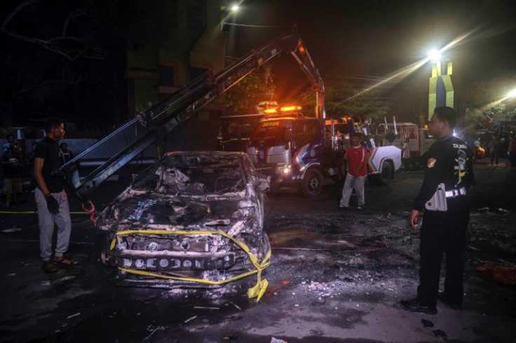 Fan anger boiled over on the streets of Malang with more than a dozen vehicles torched