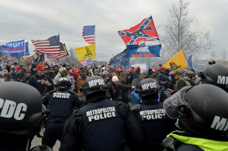 Supporters of former president Donald Trump clash with police and security forces as they storm the US Capitol on January 6, 2021