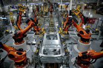 Autonomous robots assemble an X model SUV at the BMW manufacturing facility in Greer