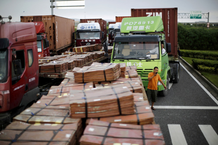 File photo of trucks carrying copper and other goods in Shanghai