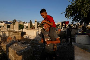 The Wider Image: Gaza struggles to accommodate the living and the dead as population grows
