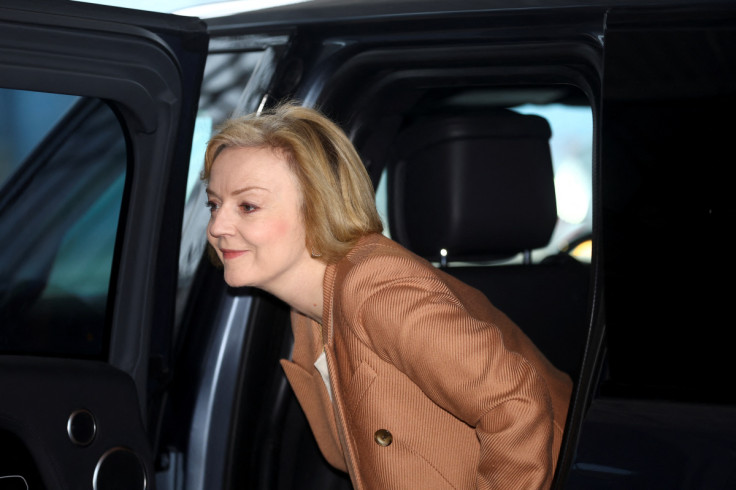 British Prime Minister Liz Truss walks outside her hotel in Birmingham