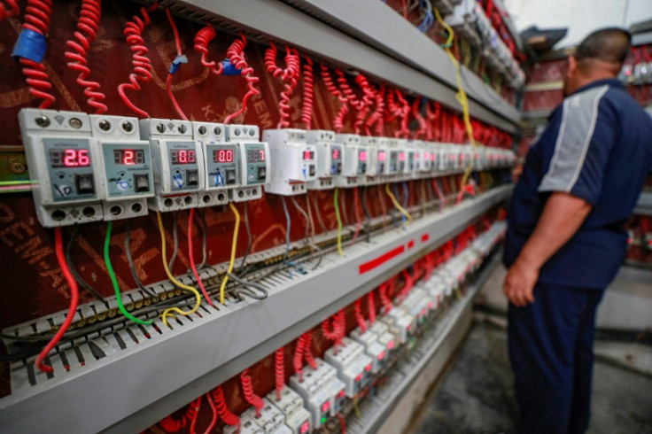 A generator technician monitors client switches in the eastern Sadr City suburb of Iraq's capital Baghdad