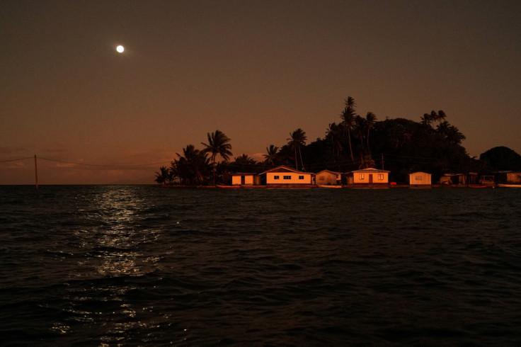 The Wider Image: Rising sea levels are forcing Fiji's villagers to relocate. They want polluters to pay instead