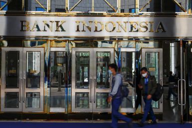 Workers leave Bank Indonesia headquarters
