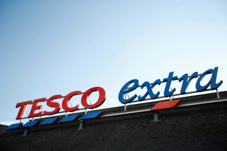 A logo of Tesco is pictured outside a Tesco supermarket in Hatfield