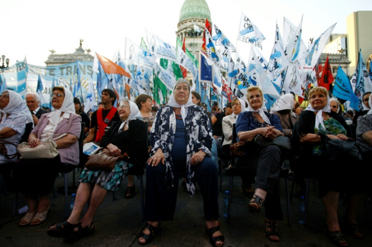 In this file photo taken on December 19, 2011, the president of the human rights organization Madres de Plaza de Mayo, Hebe de Bonafini (C), and other members of the association, are pictured during a gathering after the Argentine Congress recognized the