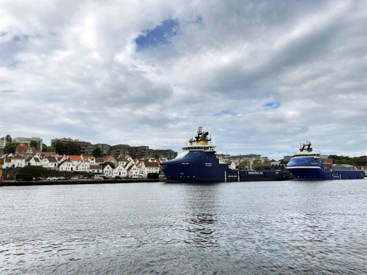 Offshore oil and gas platform supply vessels are docked at a pier in Stavanger