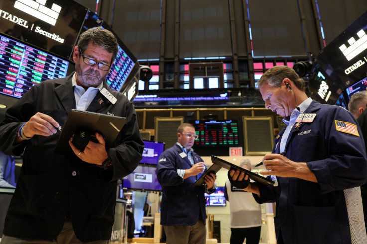 Traders work on the floor of the NYSE in New York